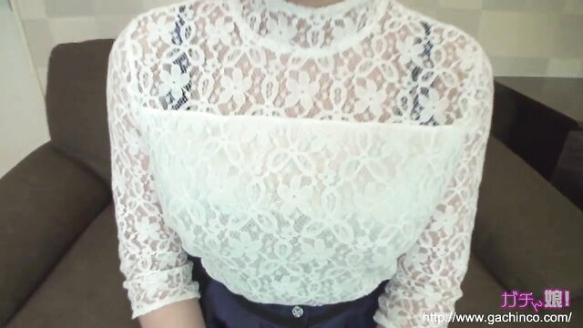 Japanese woman in sheer white lace mock neck top and black skirt