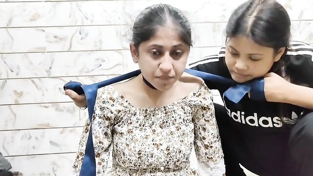 Two Indian teen girls breath play with blue scarf in amateur video