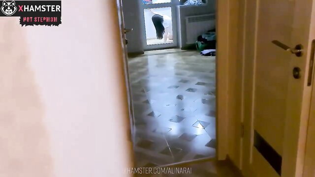 Saucy MILF bends over in doorway, teasing ass upskirt view