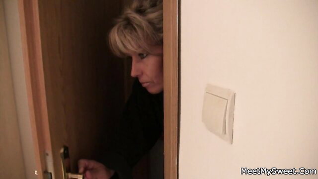 Blonde mature MILF peeking from door in taboo family threesome tease