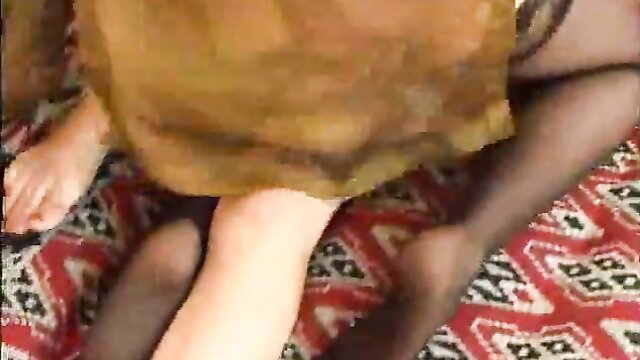 Asian amateur babe in tan dress and black stockings teases bare feet