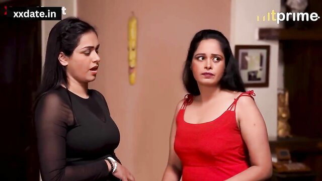 Two lewd Indian MILFs in sexy black sheer top and red dress