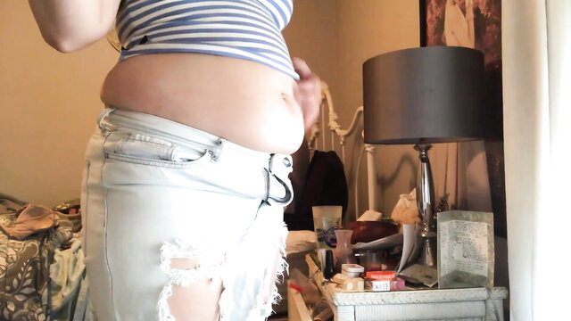 Chubby BBW in tight striped top and ripped jeans showing off fat belly