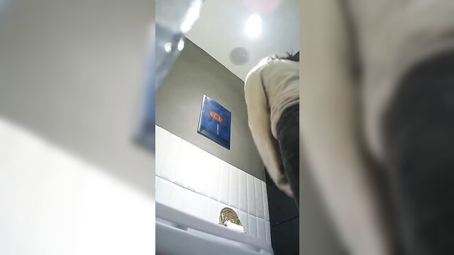 Spy cam captures Asian woman peeing in boutique toilet stall