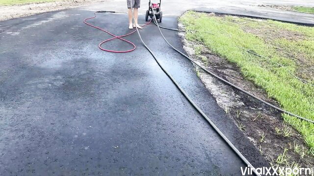 Bryce Adams fit legs spread by pressure washer in driveway tease