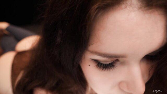 Closeup of sexy brunette's face and cleavage in Kitty Klaw feet RP