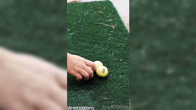 Gracecharisxo hand on tennis balls outdoor grass tease