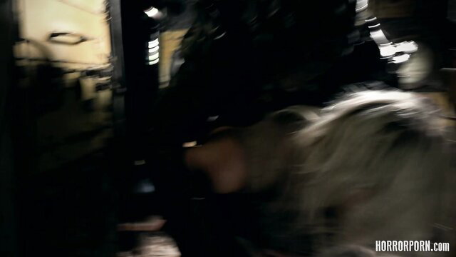 HorrorPorn Alien Invaders: blonde woman facehugged by alien invader in dark sci-fi horror