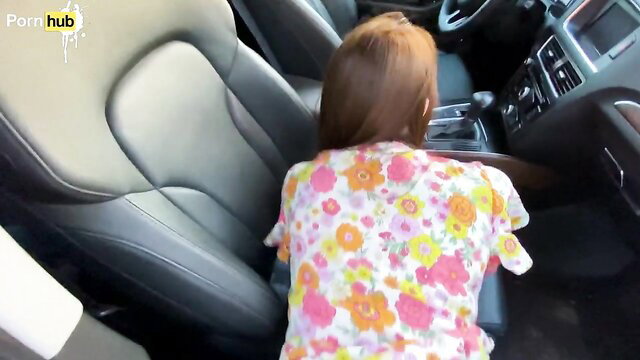Young stepmom in floral top bent over car seat, ready for stepson fuck