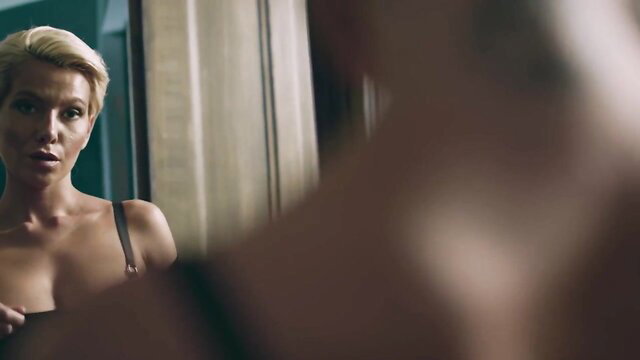 Two nude blonde lesbians kissing passionately while fingering