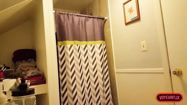 Busty amateur teen stripping in bathroom on hidden cam