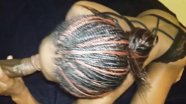 Ebony woman with braids sucking thick cock in lingerie closeup