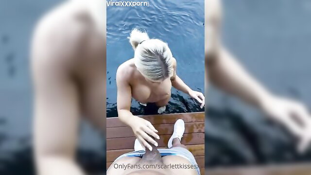 Busty blonde ScarlettKissesXO topless poolside on OnlyFans