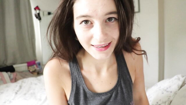 Cute brunette girlfriend in tank top smiles in ASMR lingerie tease
