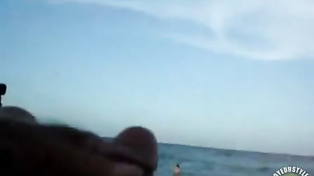 POV closeup of man stroking hard cock at beach sunset solo masturbation