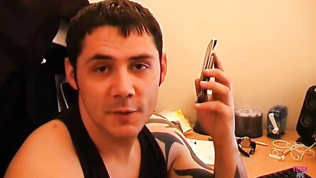 Sensual brunette with big tits holds phone in tank top