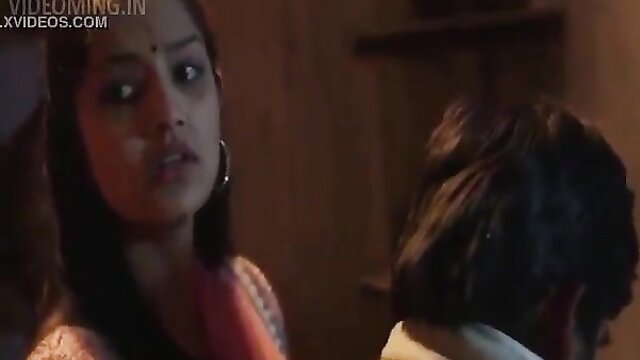 Hot Indian bhabhi in saree stares seductively at man in steamy mallu scene