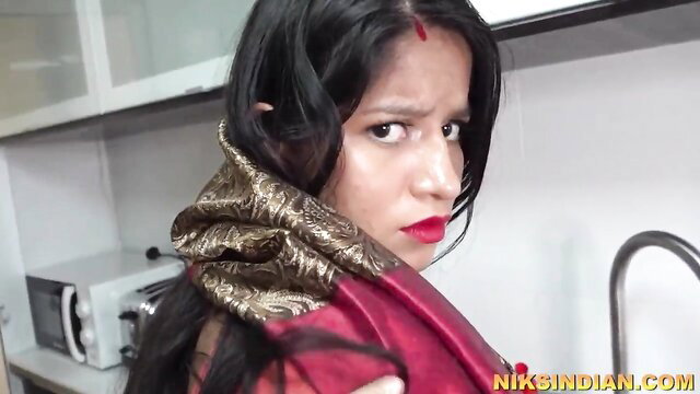 Seductive Indian maid in red saree with huge tits in kitchen