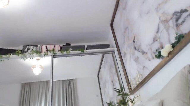 MarrylouAnne in pink lingerie on bed, sexy Chaturbate cam tease