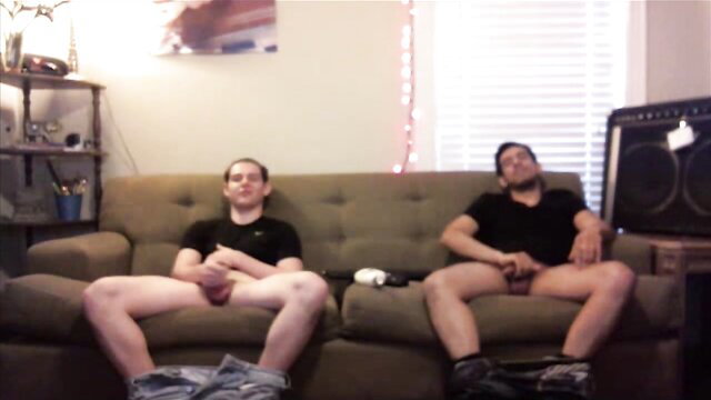 Secretly filmed Latino buds jerking off on couch, exposed cocks