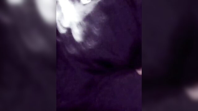 Blurry purple-tinted closeup of Asian man's shaved cock tease in amateur video