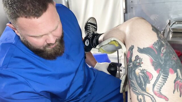 Teddy Bryce fists tattooed guy in blue scrubs fisting scene