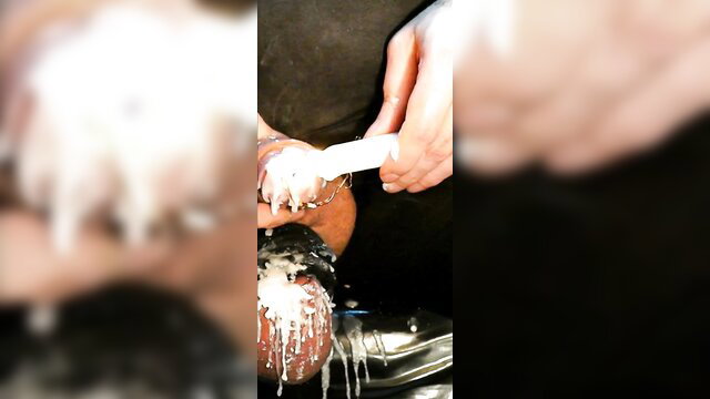 Extreme hot wax in peehole and on glans candle burning fetish closeup