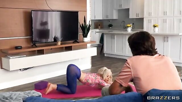 Kenzie Reeves in yoga pants doing downward dog for stepdad