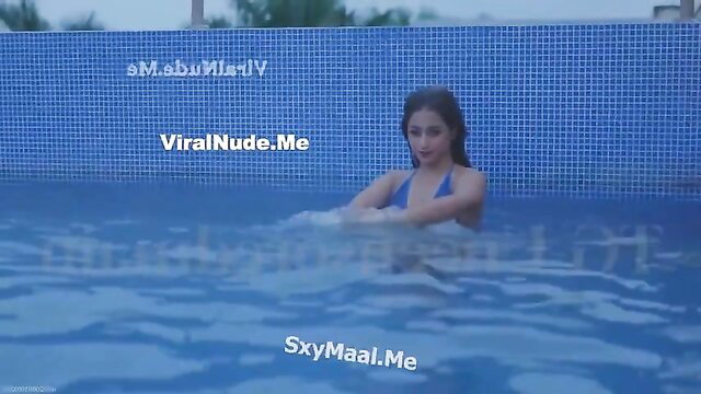 Indian beauty Udita in skimpy blue bikini pool tease nude app video