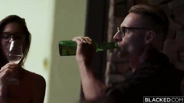 Brunette sipping wine with handsome man drinking beer in steamy threeway setup