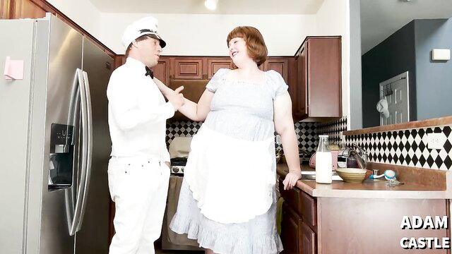 She-male and milkman in a kitchen, engaging in anal sex