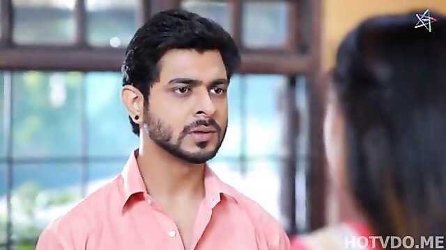 Handsome Indian man in pink shirt gazes at woman in hot Vimukti web series