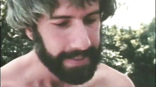 Hairy bearded man shirtless in 1983 Reel People adult documentary