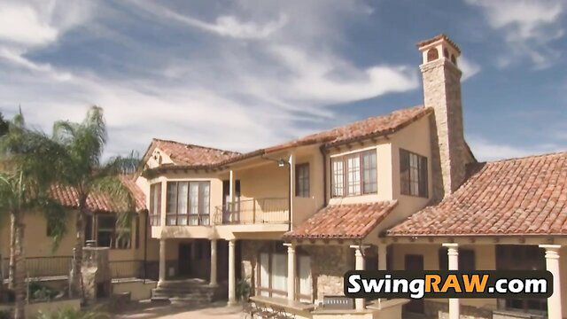 Luxury Spanish villa exterior with pool under sunny skies