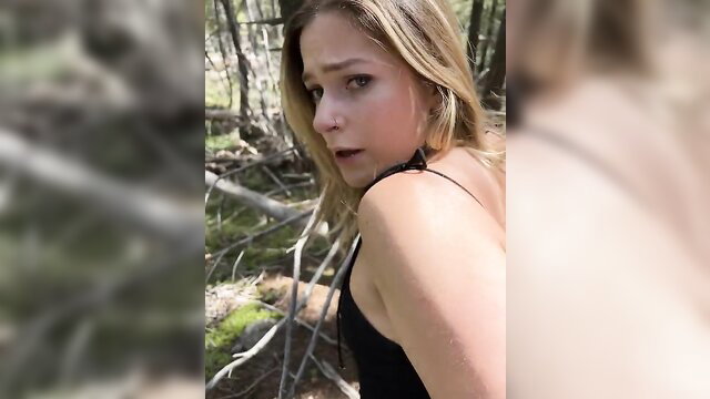 Blonde amateur sneaks off trail, teases in black dress in woods