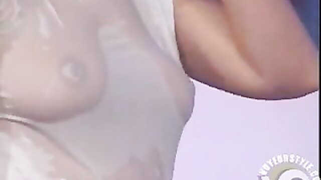 Woman's sheer wet top exposing nipples in kinky TV contest