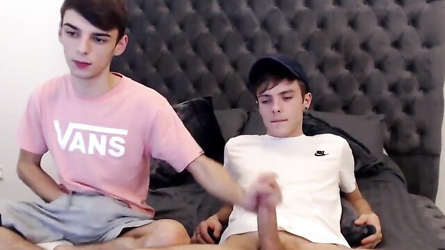 Gay teen boys couple on cam, one stroking dick while gaming