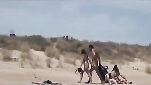 Nude swingers and dog caught fucking on beach voyeur video