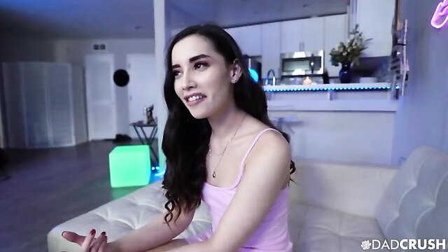 Aria Lee smiling in pink tank top, sexy home vibe