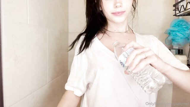 Puppiwi showing off her tits in bathroom, wet look amateur tease