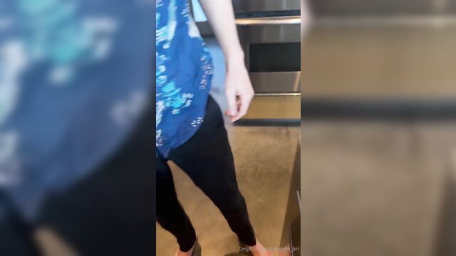 Trippie Bri in tight blue top and leggings in kitchen tease