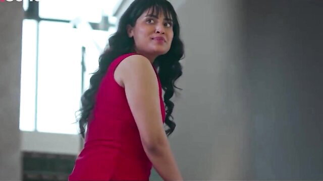 Raunchy Indian girl in tight red dress smirks seductively