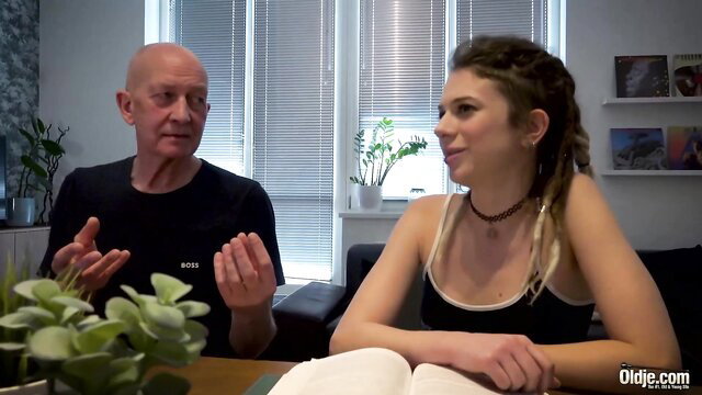 Bald older man debates penis with young brunette dreadlocks girl Eva Fay