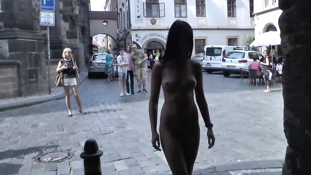 Nude black European teen exhibitionist walks naked in public street