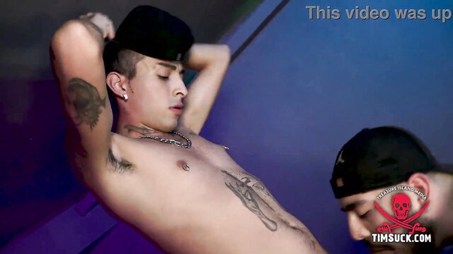Tattooed Latino twink deepthroats in domination blowjob