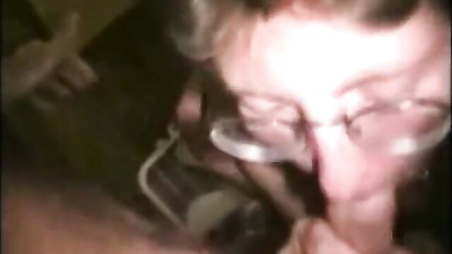 Closeup of mature woman with glasses sucking cock clean in ATM porn