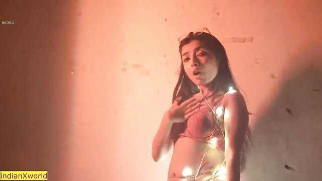 Indian college girl in pink bra with fairy lights hot solo tease
