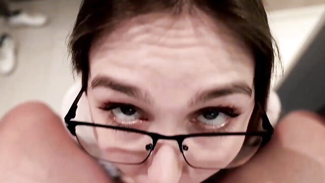 Closeup POV of busty stepmom's intense gaze in glasses, aroused expression