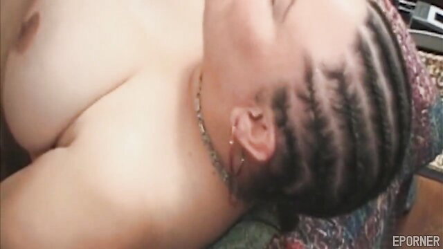 Horny black BBW with cornrows lying topless, huge tits exposed