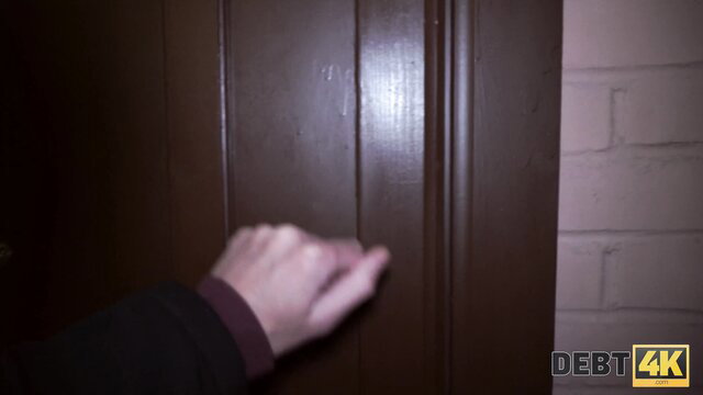 Hand gripping door handle in Debt4K adult video thumbnail